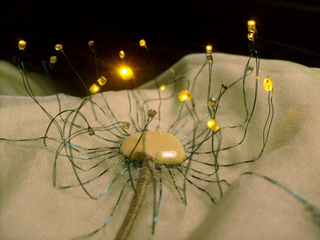 Illustration for article titled Wind-Sensitive LED Dandelion Dress Is Made for Pretty Night Fairies